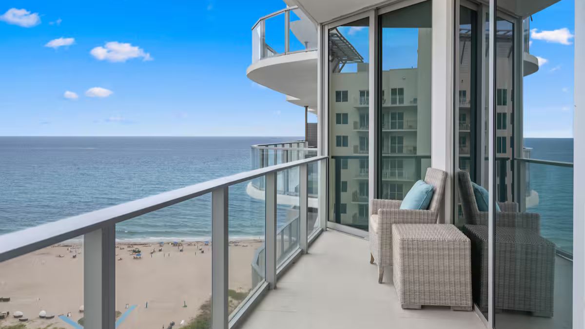 Furnished oceanview balcony at Amrit Ocean with modern outdoor furniture and Atlantic views